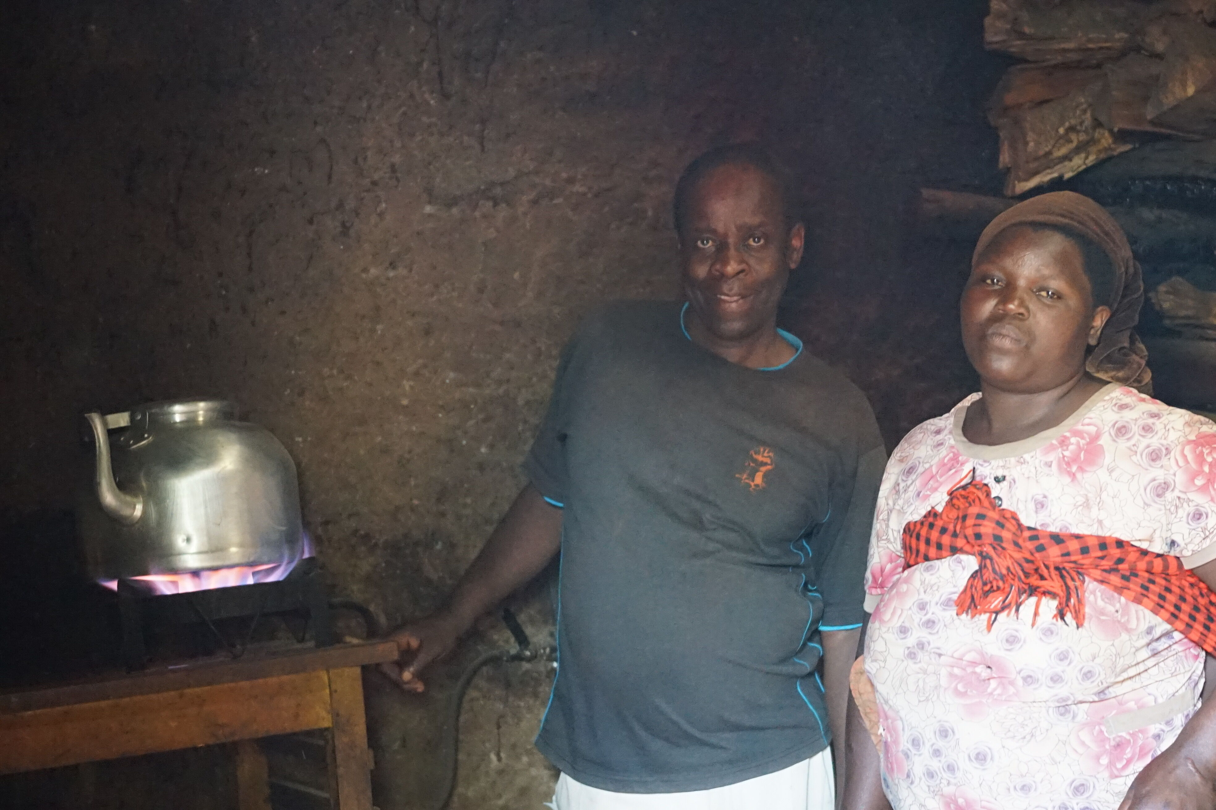 Bulambuli farmer with bio gas stove.JPG